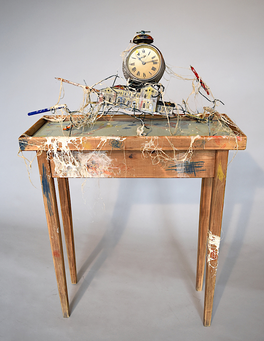 Tough path to go to work, contemporay art and time .Composite contemporary sculpture, plastic train station model, old clock, pencils. artist Piet.sO 