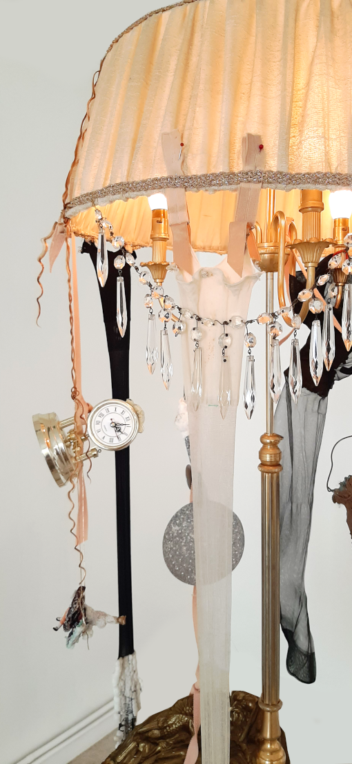 contemporary art et time. contemporary composite sculpture with floor lamp and objects damaged by time by artist Piet.sO