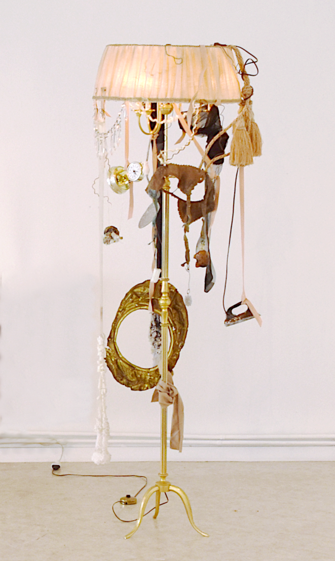 contemporary art et time. contemporary composite sculpture with floor lamp and objects damaged by time by artist Piet.sO 
