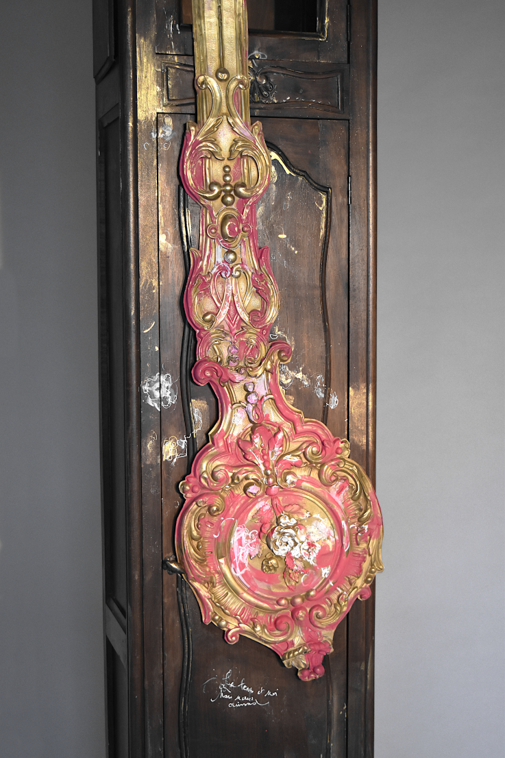  The time and me, contemporary composite sculpture of a Normandy long-case clock sticking its tougue out, artist Piet.sO 2025. 